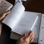 person flipping book