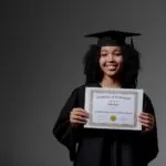 Woman in Black Academic Dress Holding White Certificate